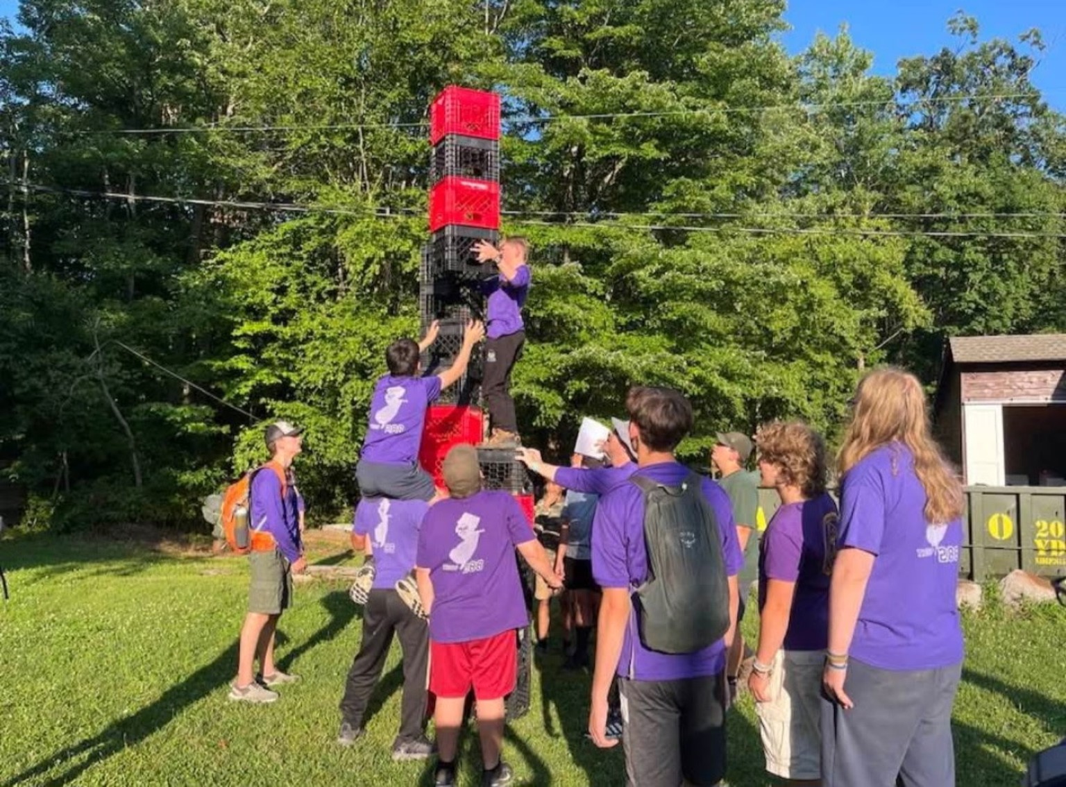 Troop 288 Scouts working together on an outdoor team challenge